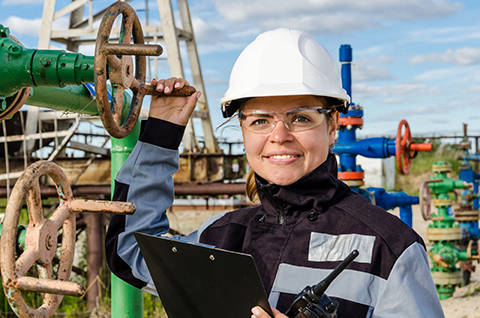 woman engineer checking oil and gas equipment